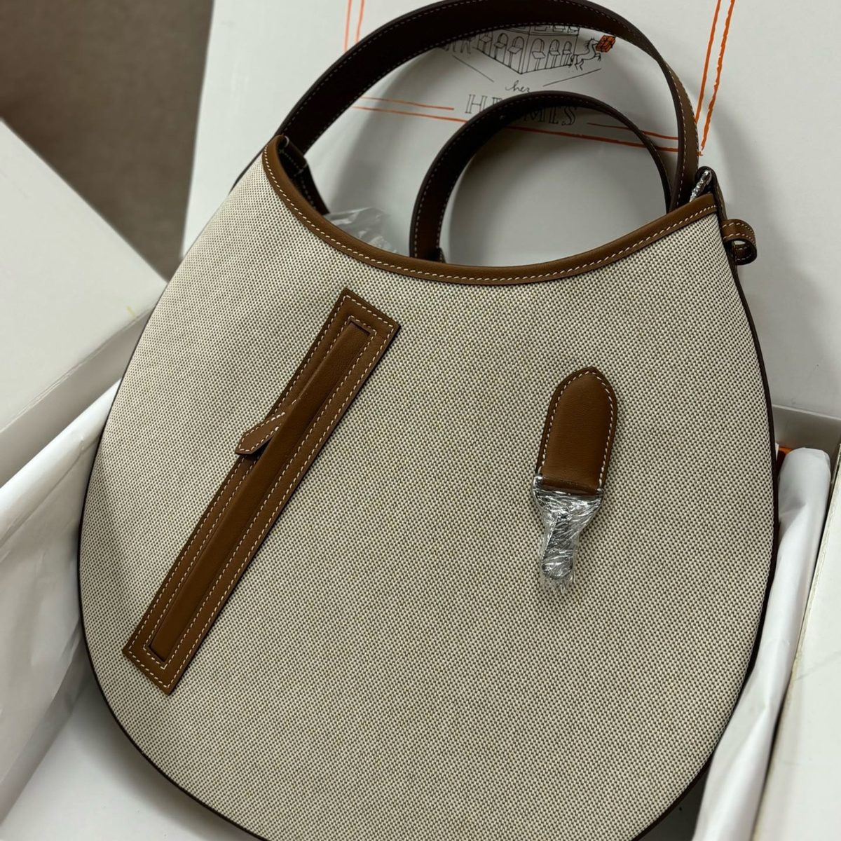 Hermès – P’tit Arçon-tas in canvas en leer