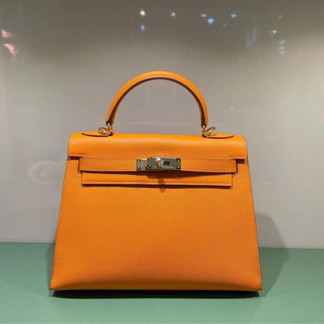 Hermès – Kelly 25-tas in oranje met goudkleurige hardware