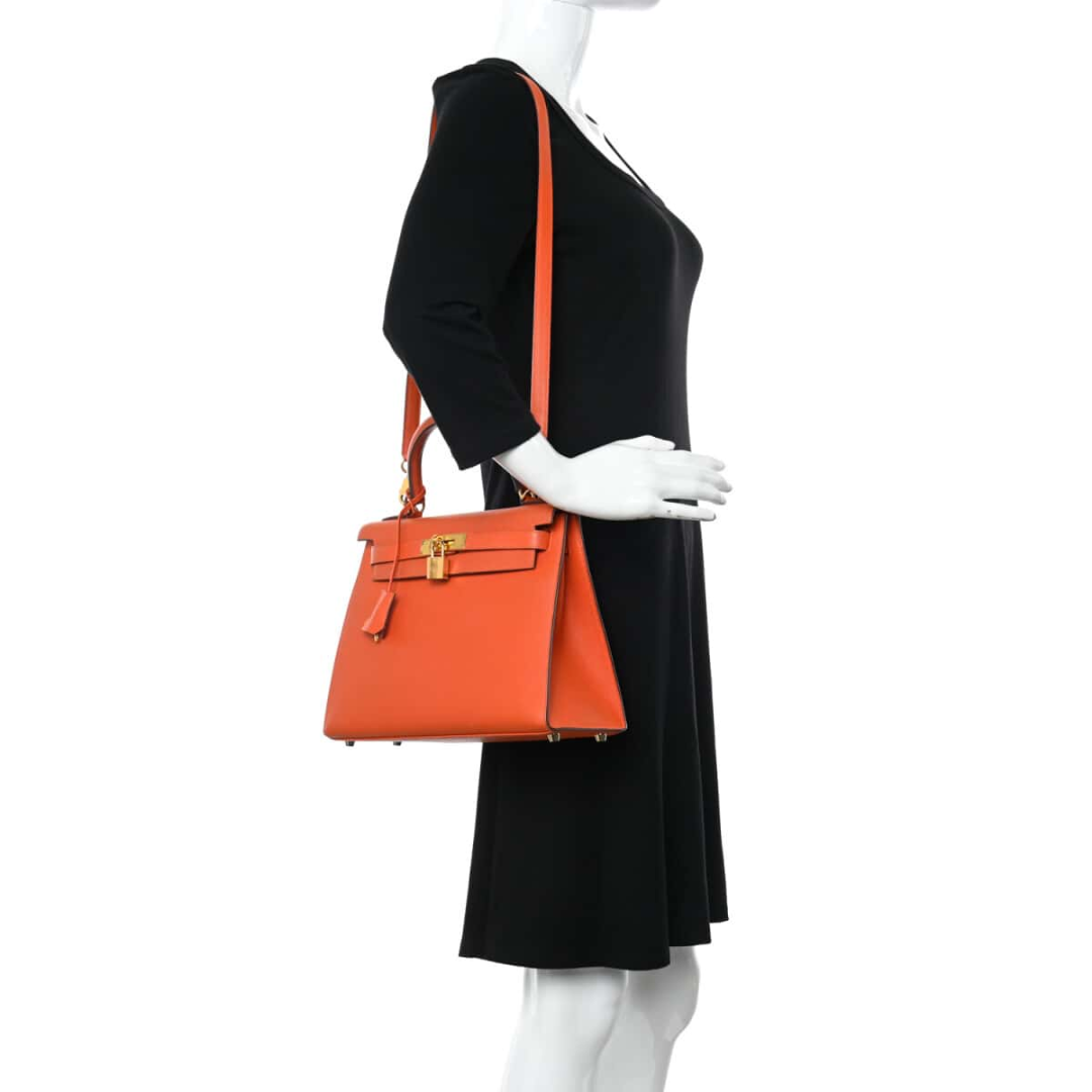 Hermès – Kelly 25-tas in oranje met goudkleurige hardware