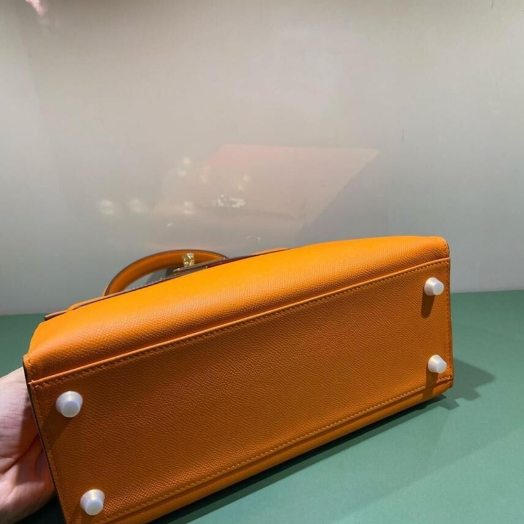 Hermès – Kelly 25-tas in oranje met goudkleurige hardware